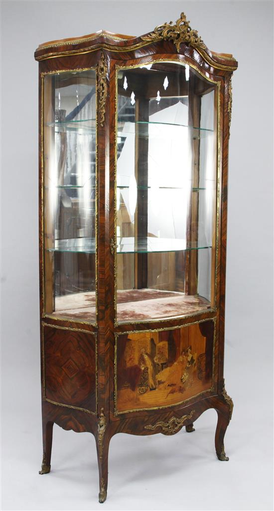 A Louis XV style rosewood and ormolu mounted serpentine shape vitrine, H.5ft 9in.